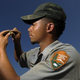 A Park Service worker examines an artifact. (Tracy A. Woodward/Washington Post)